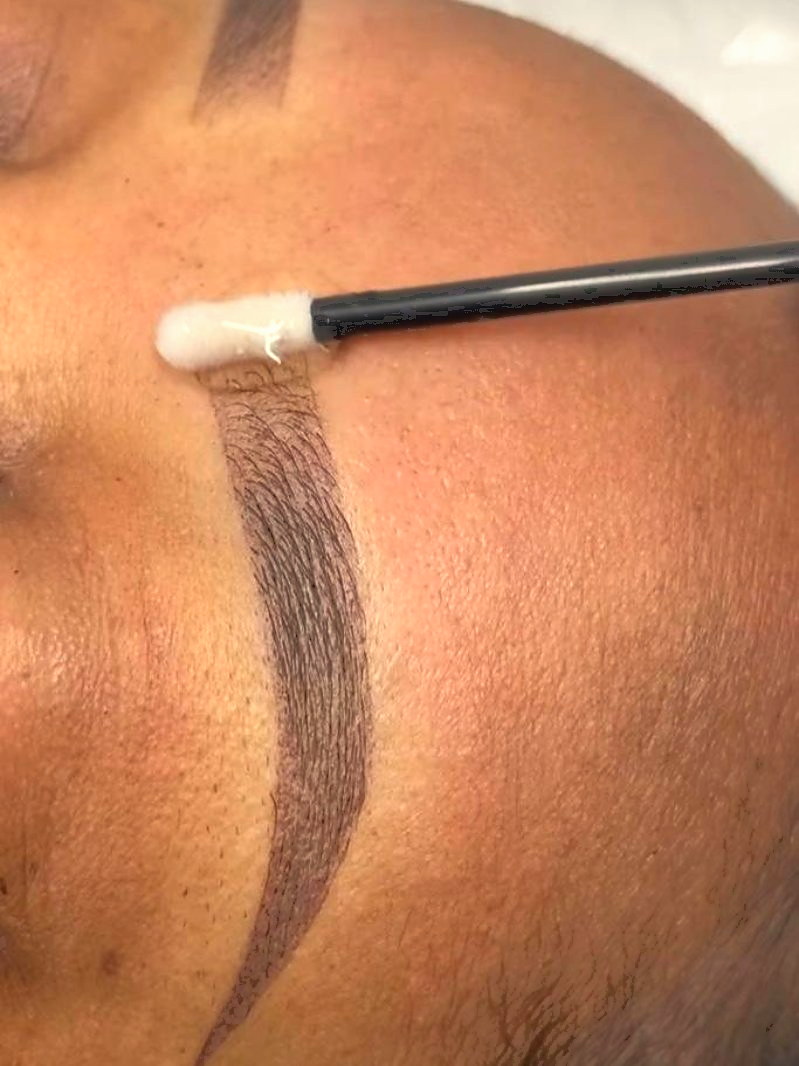 Brow being finished with a brush