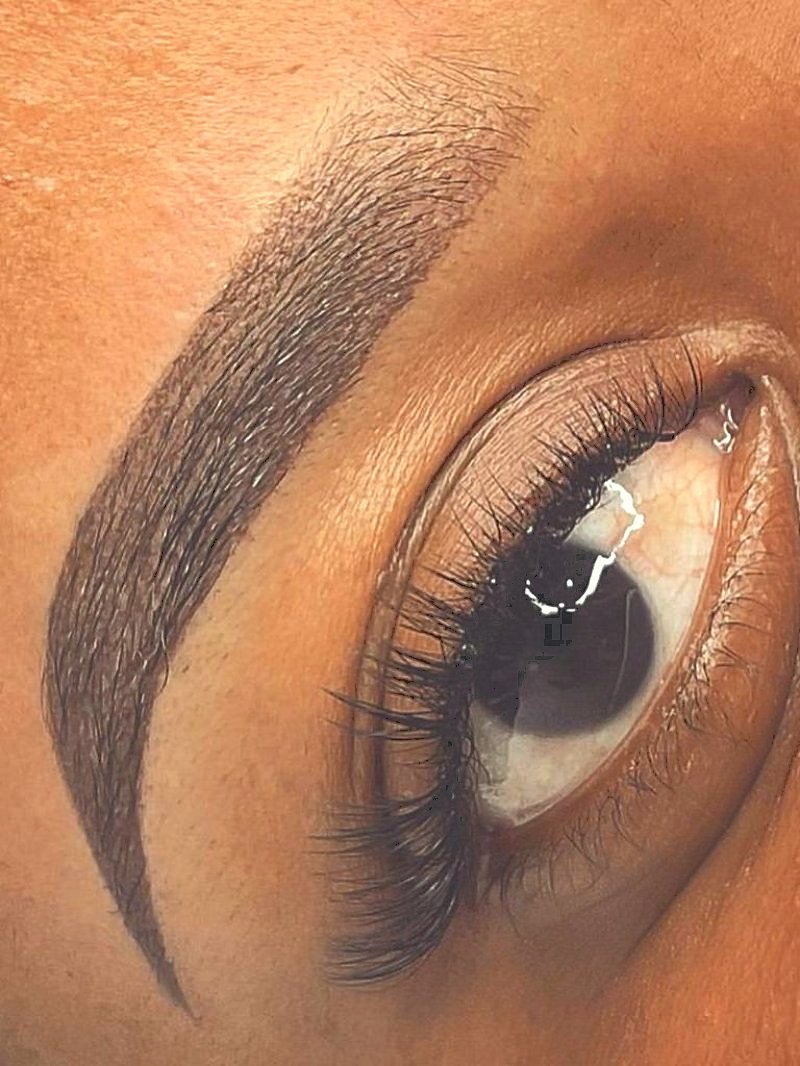 Healed brow and lash work on deep skin